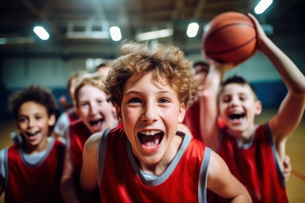 Young basketball players celebrating cheerful sports child. 