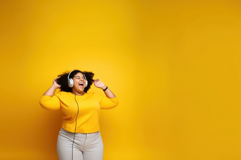 photo of a happy chubby woman wearing earphones.  