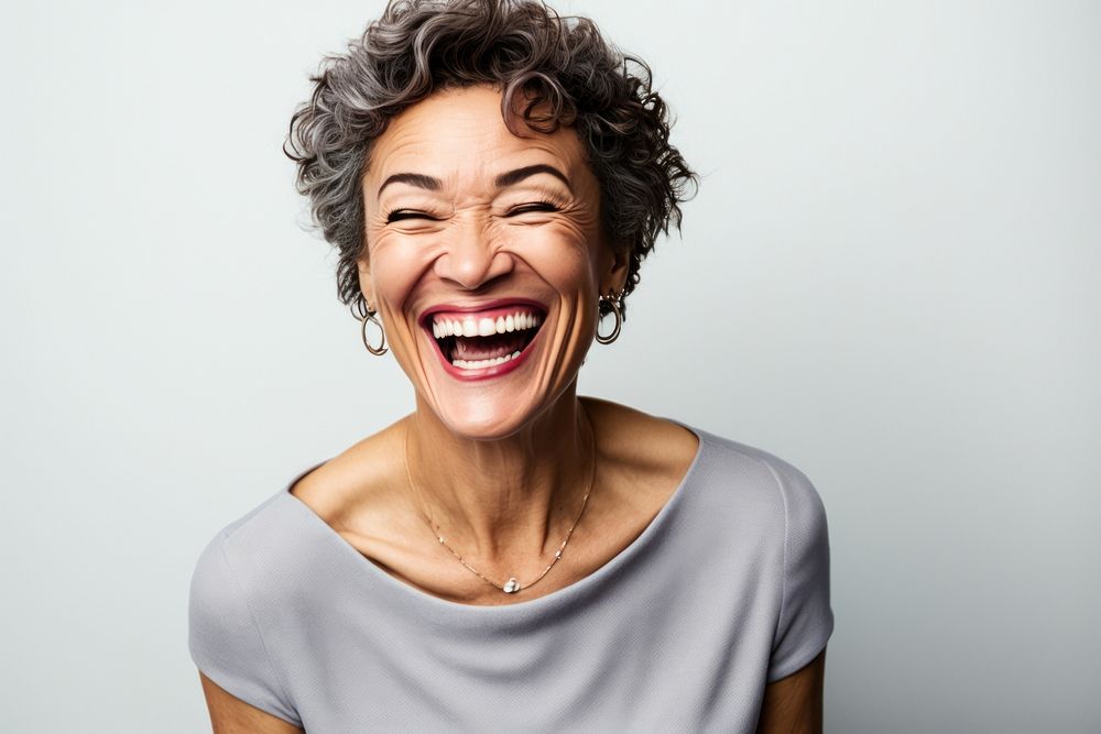 Mixed race middle age woman laughing cheerful accessories excitement. AI generated Image by rawpixel.