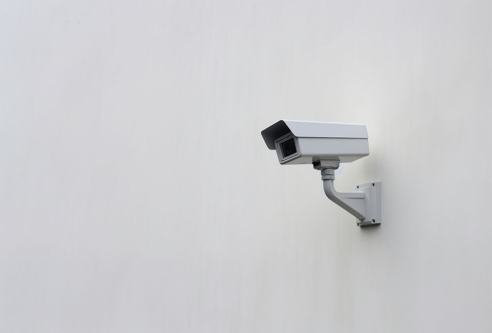 Security camera wall surveillance architecture. AI generated Image by rawpixel.