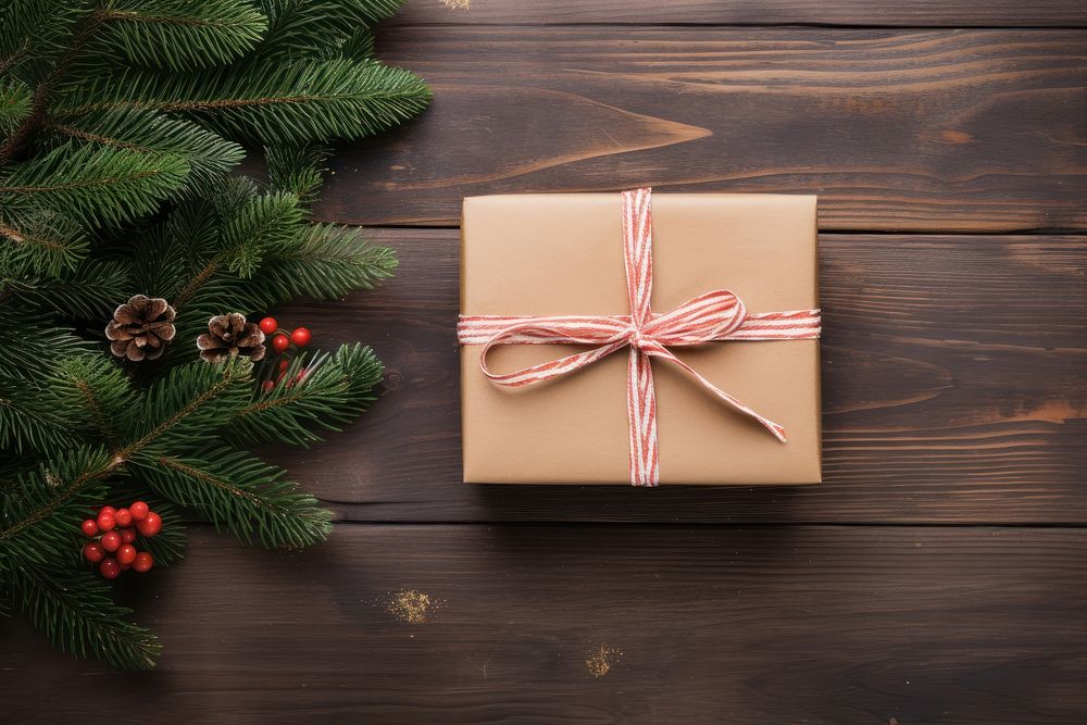 Hands exchanging gift box christmas wood anticipation. 