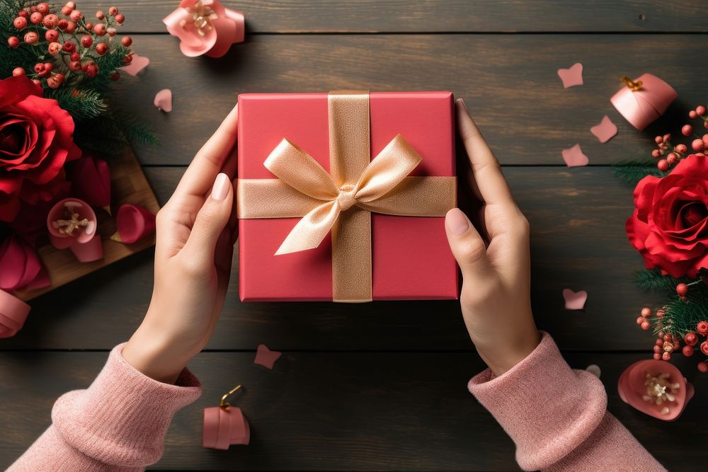 Hands exchanging gift box celebration anniversary accessories. AI generated Image by rawpixel.