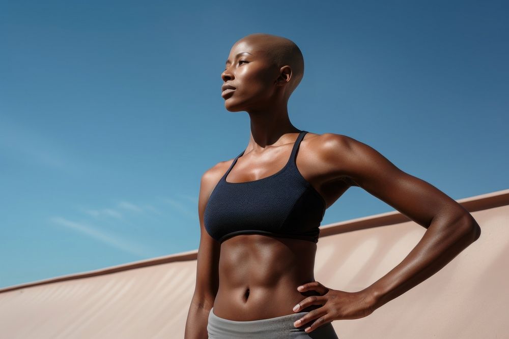 Black bald woman adult sky determination. AI generated Image by rawpixel.