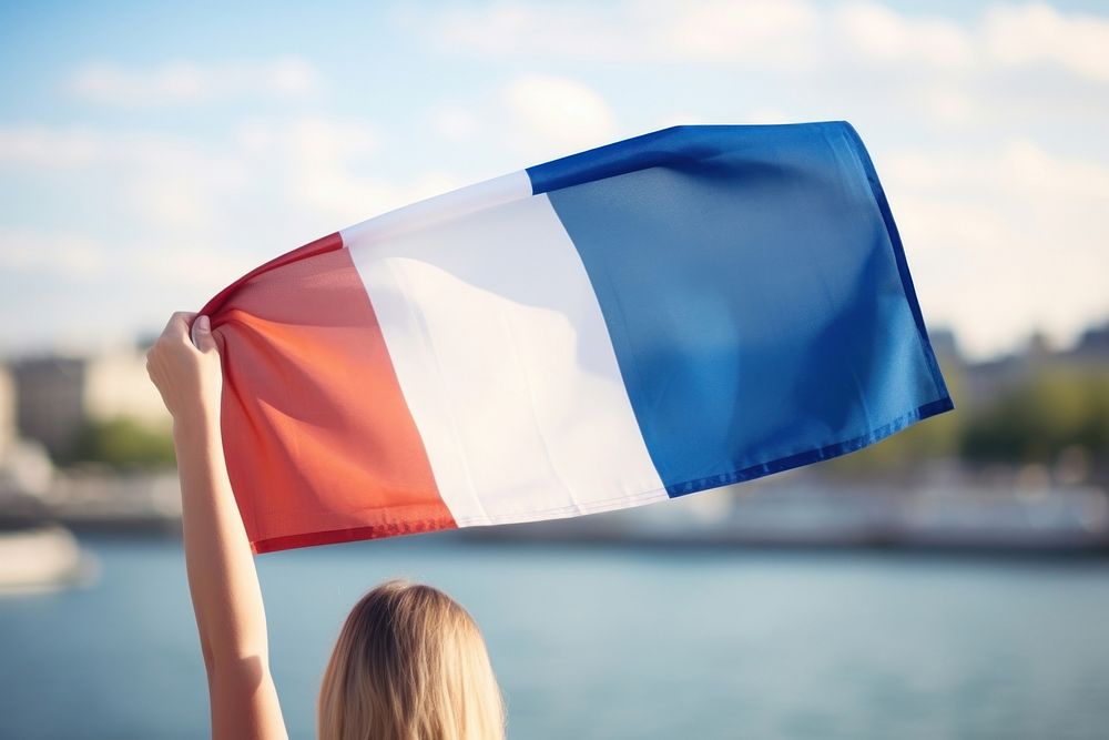 Hand holding french flag independence celebration patriotism. 