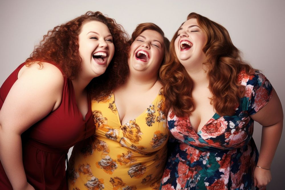 Three cheerful chubby women laughing portrait adult. 