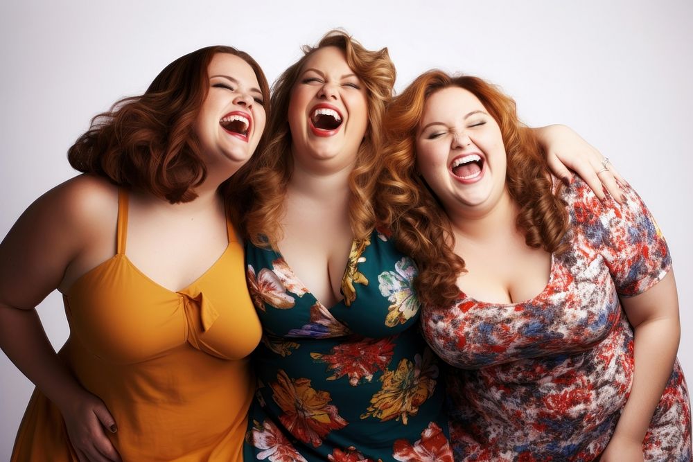 Three cheerful chubby women laughing togetherness friendship. 