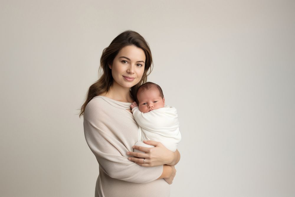 Holding newborn baby portrait. 