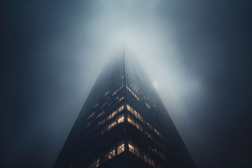 Tall office tower fog architecture skyscraper. 