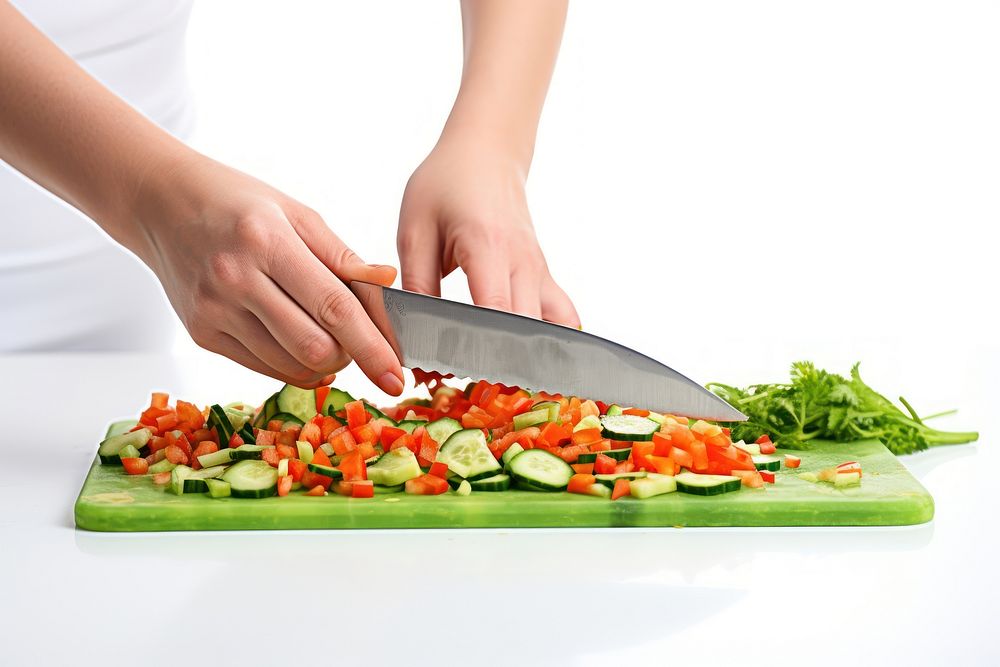 Hand holding knife vegetable chopping food. AI generated Image by rawpixel.