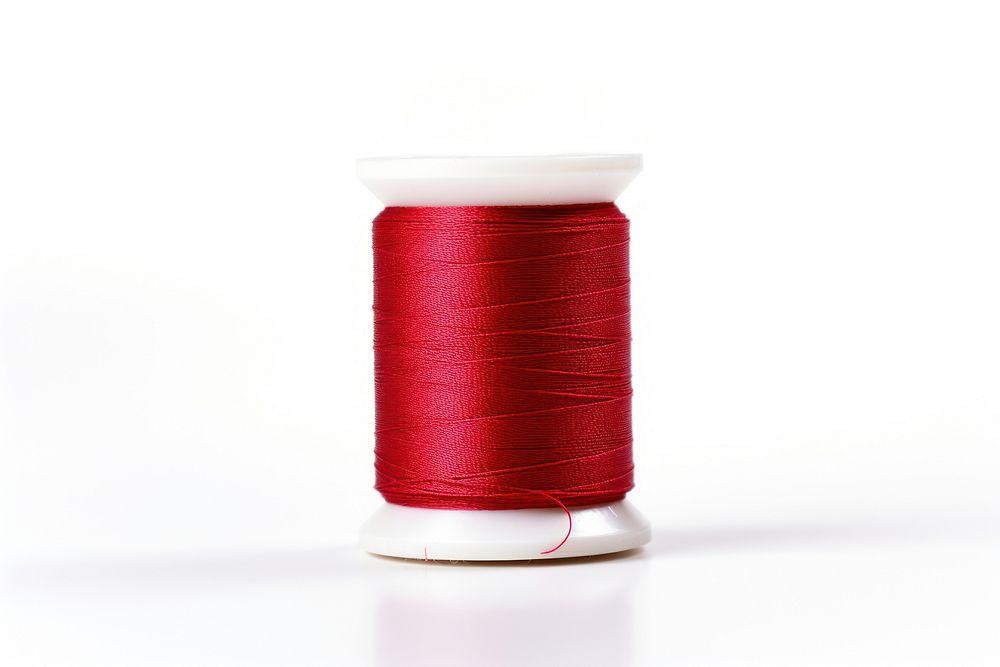 Thread needle spool white background. AI generated Image by rawpixel.