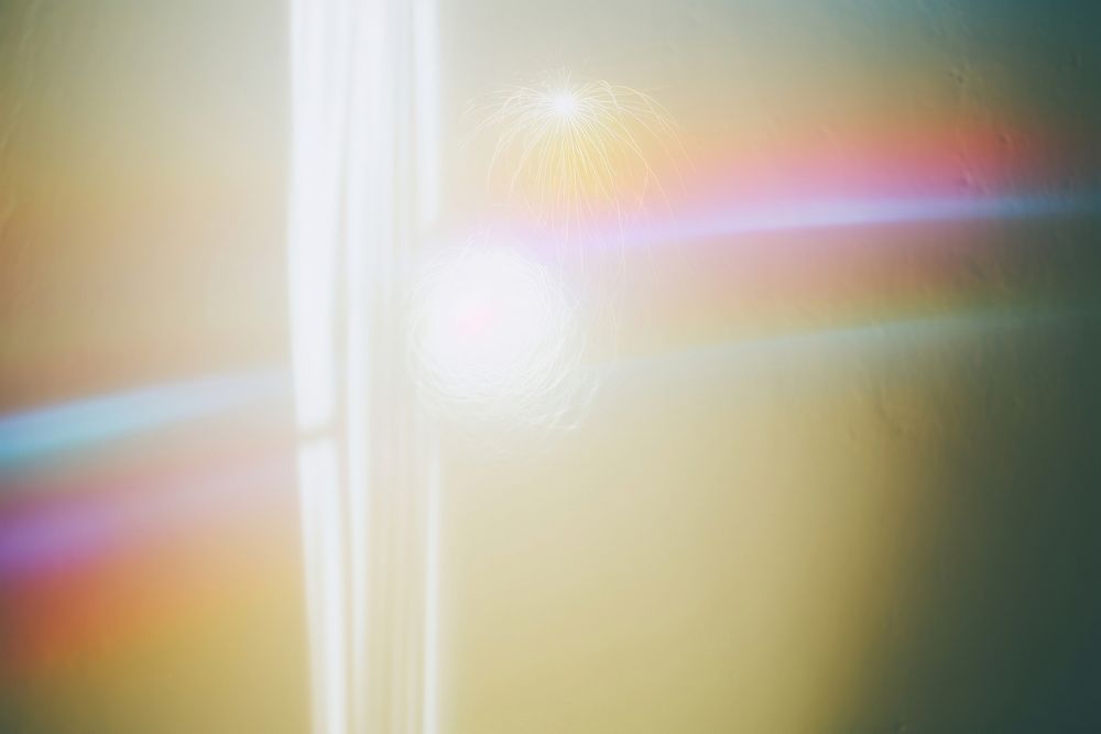 Light backgrounds rainbow flare. AI generated Image by rawpixel.