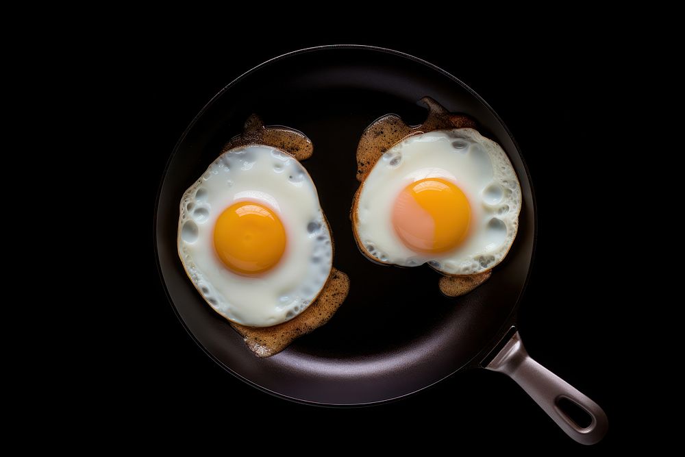 Fried eggs food pan breakfast. AI generated Image by rawpixel.