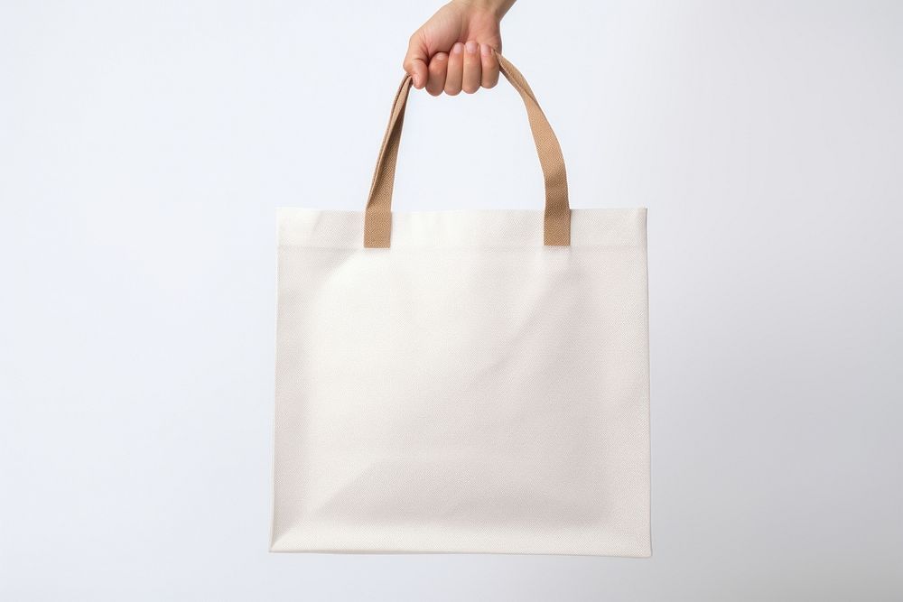 Man holding blank tote bag handbag white accessories. 