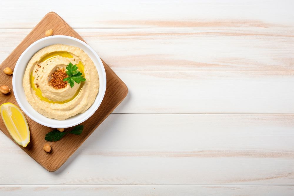 Hummus table food wood. AI generated Image by rawpixel.