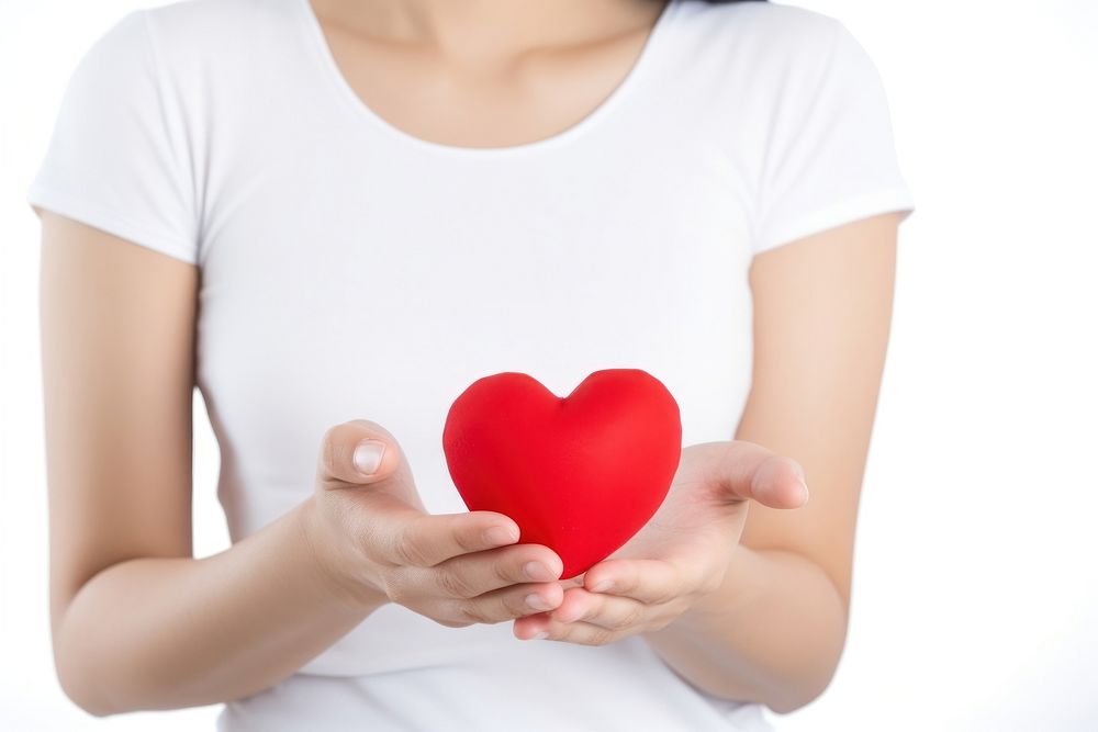 Heart shape t-shirt holding red. 