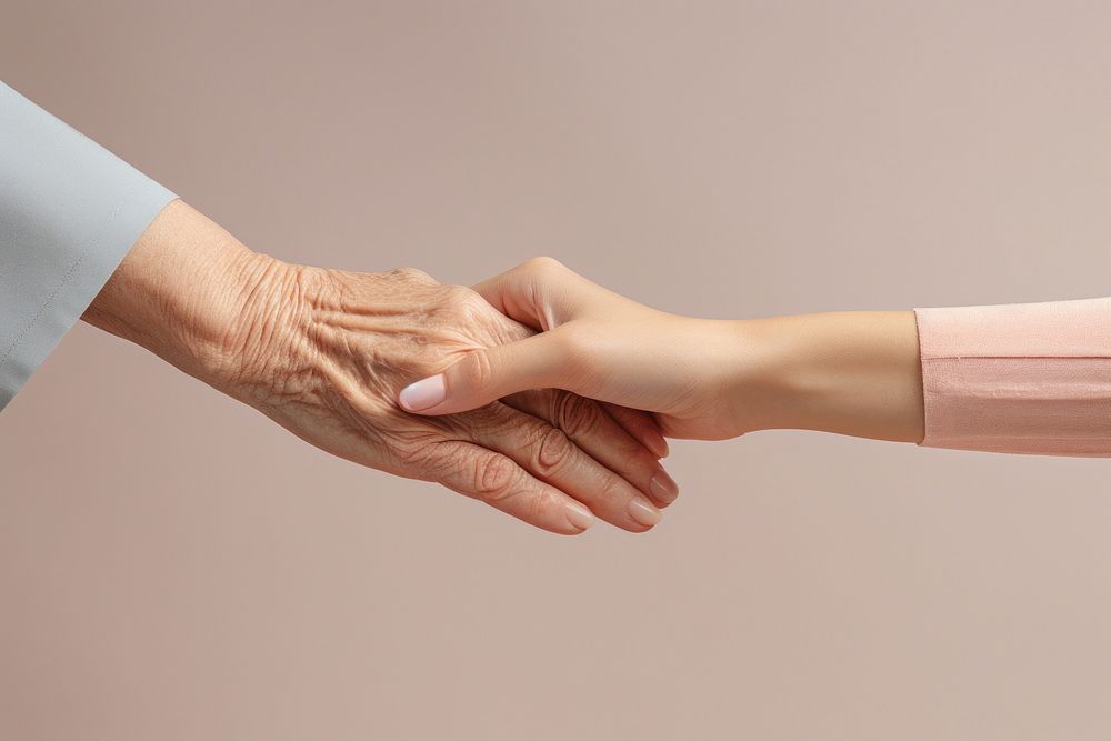 Women holding old woman hand togetherness handshake agreement. 