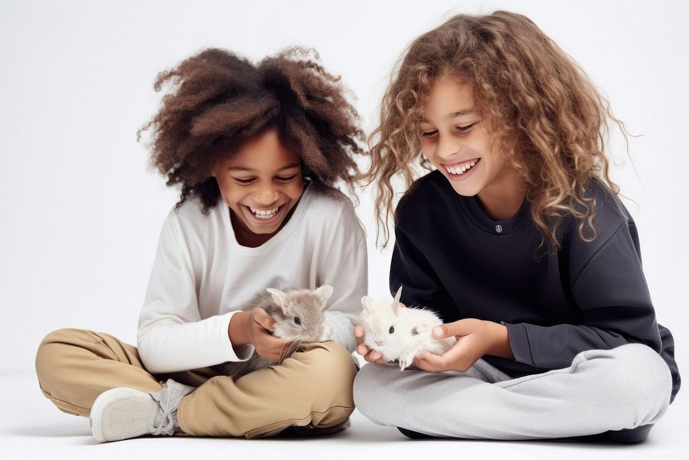 Kids feeding a rabbit adult smile fun. 