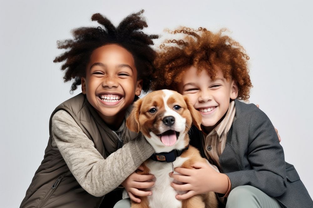 Kids hugging a dog laughing mammal animal. 