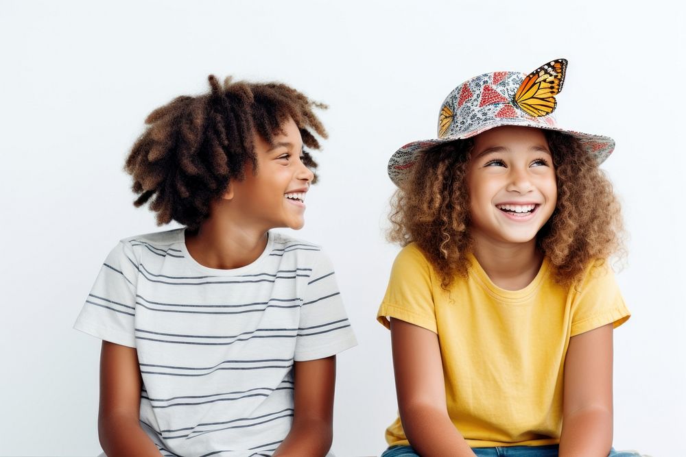 Kids watching a butterfly smile laughing child. 