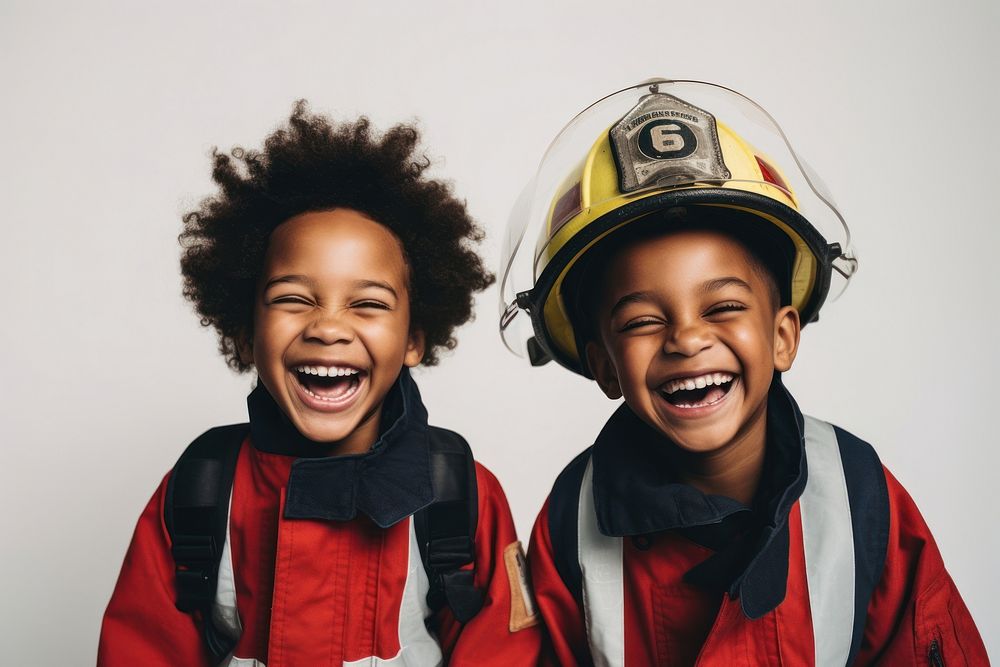 Kids wearing firefighter costume laughing smile fun. AI generated Image by rawpixel.