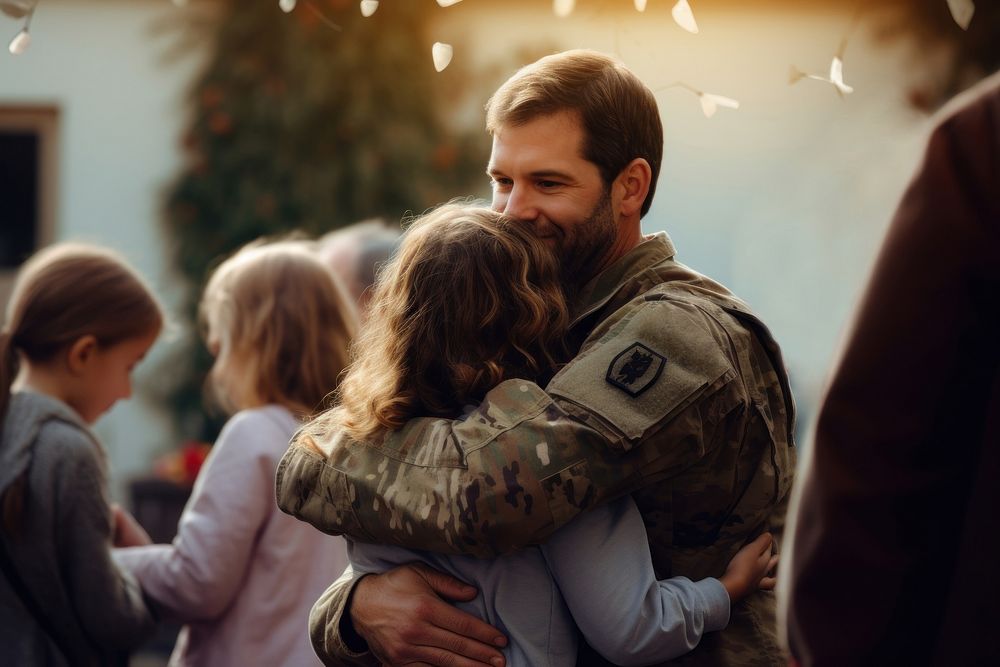 Cheerful soldier hugging family. 