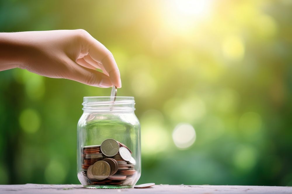 Glass coin hand jar. 