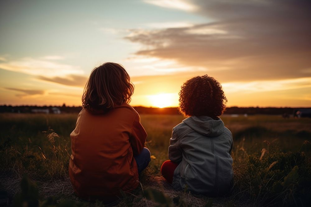 Two diversity kids watching sunset photography outdoors nature. AI generated Image by rawpixel.