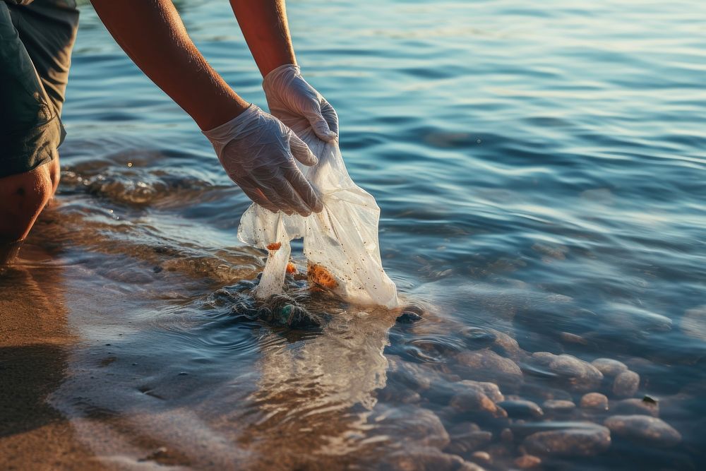 Plastic bags outdoors nature glove. AI generated Image by rawpixel.