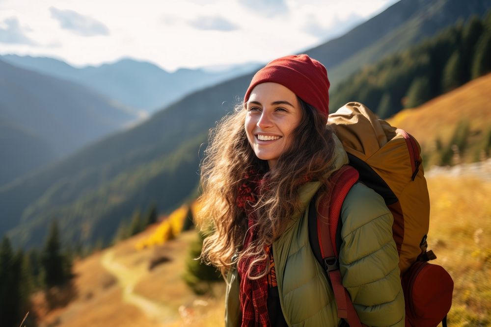 Photo of happy smiling woman hiking in mountains.  