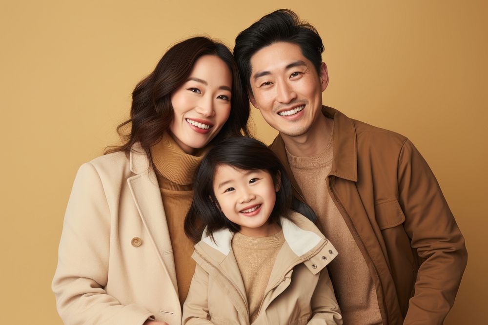 Asian family smiling adult coat. AI generated Image by rawpixel.