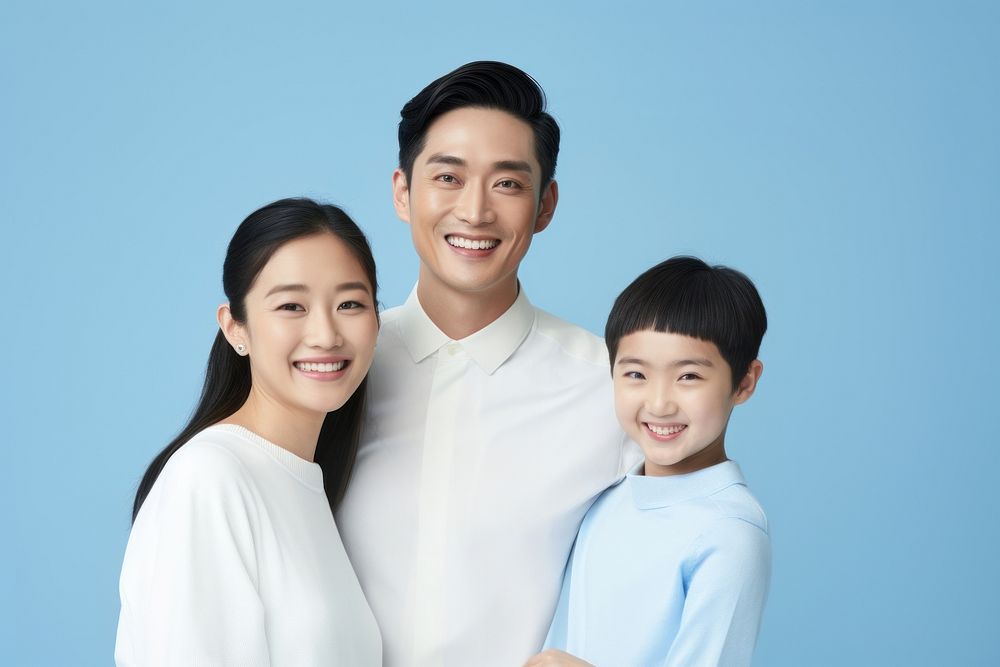 Asian family smiling adult blue. AI generated Image by rawpixel.