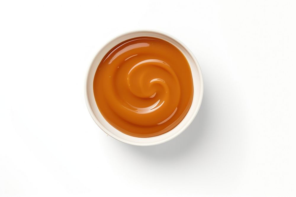 Caramel sauce bowl white background freshness. AI generated Image by rawpixel.