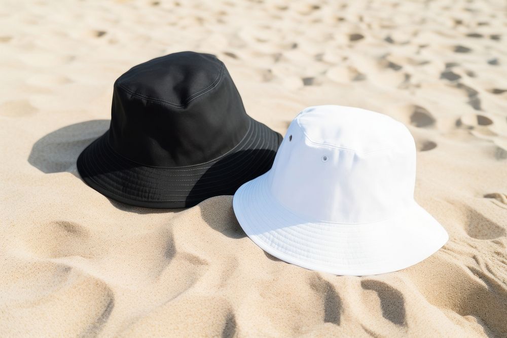 Bucket hats white black sand. 