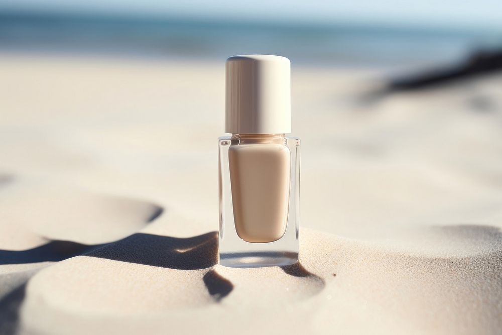 Nail polish bottle cosmetics beach day. 