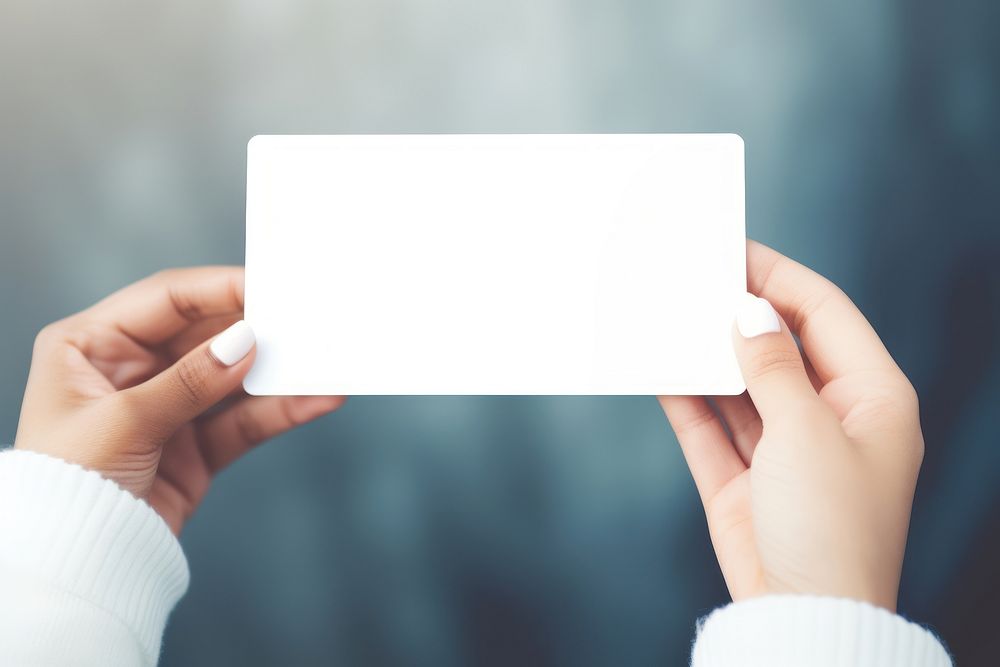 Card holding photo hand. 