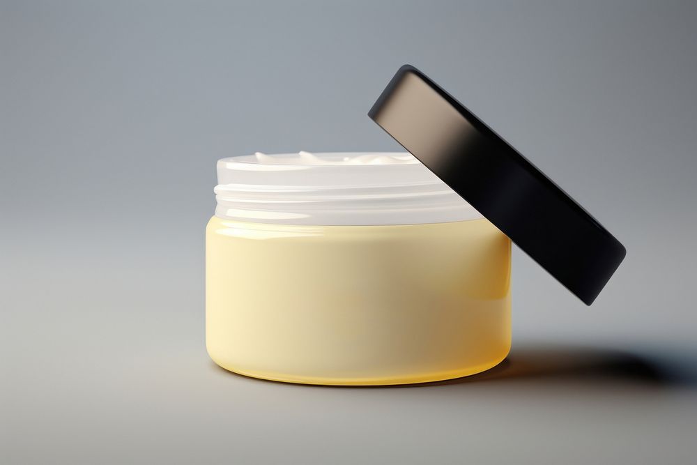 Cream container cosmetics lighting yellow. AI generated Image by rawpixel.