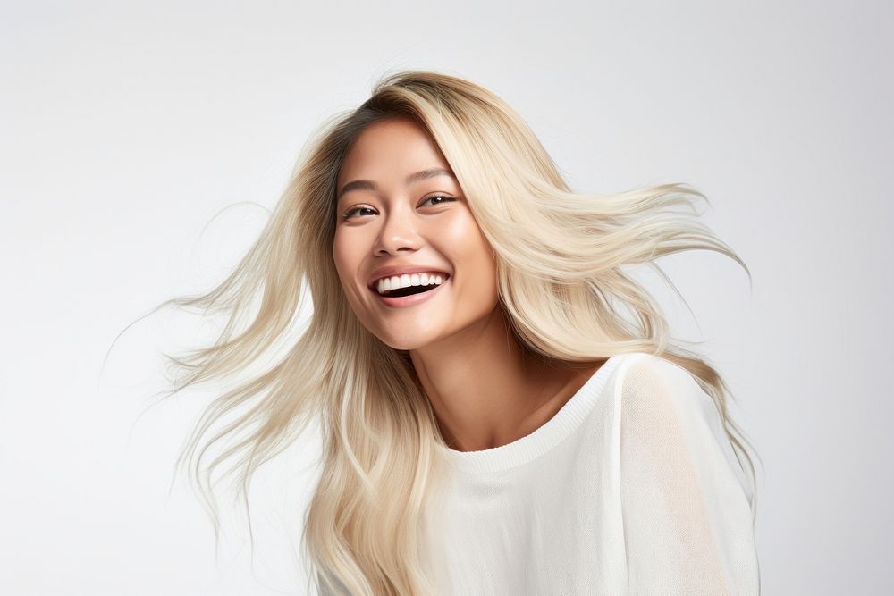 Happy asian blond woman laughing adult smile. AI generated Image by rawpixel.