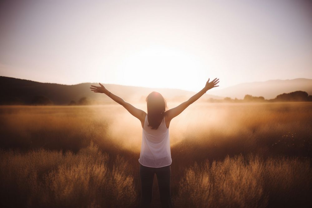 Woman raised arms spirituality tranquility silhouette. 