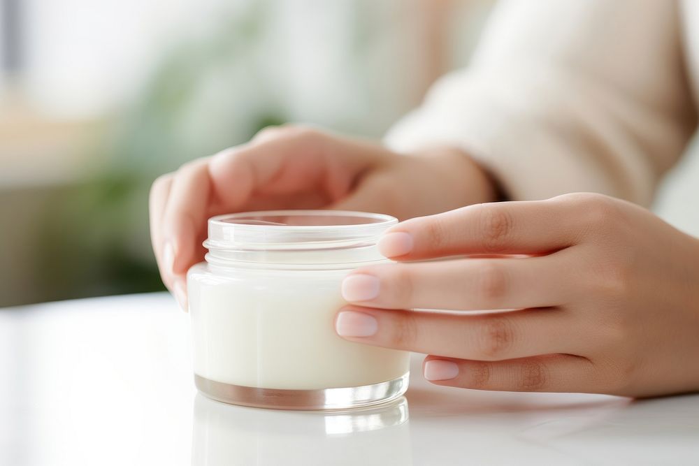 Moisturizer jar holding glass. 