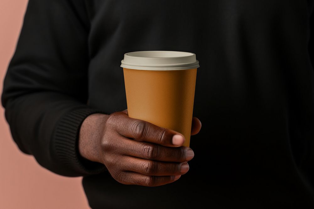 Premium Photo  A man holds a cardboard cup holder with two disposable coffee  cups takeaway drinks