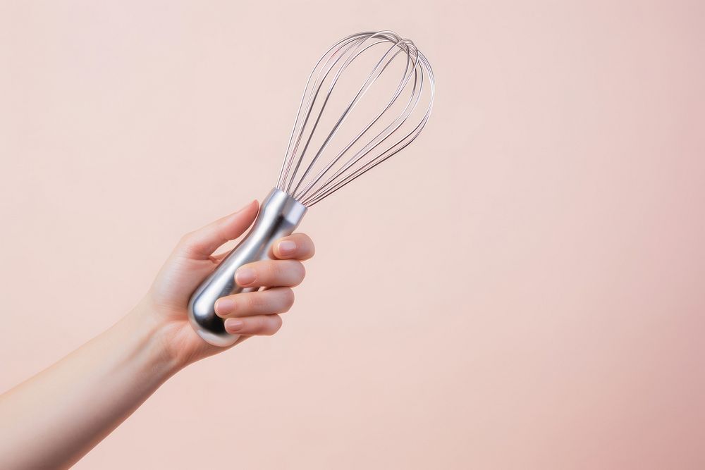 Egg beater holding hand appliance. AI generated Image by rawpixel.