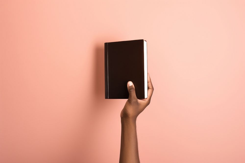 Holy bible publication holding hand. AI generated Image by rawpixel.