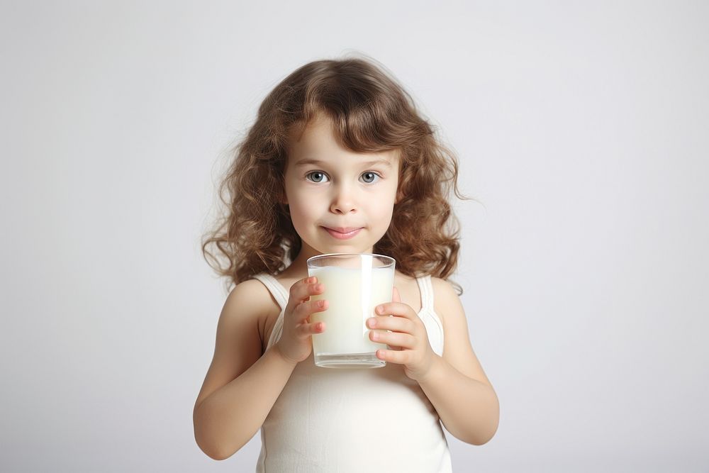 Children girl drinking milk portrait. 