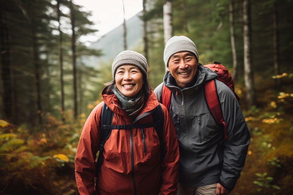 Mature asian couple forest recreation adventure. 