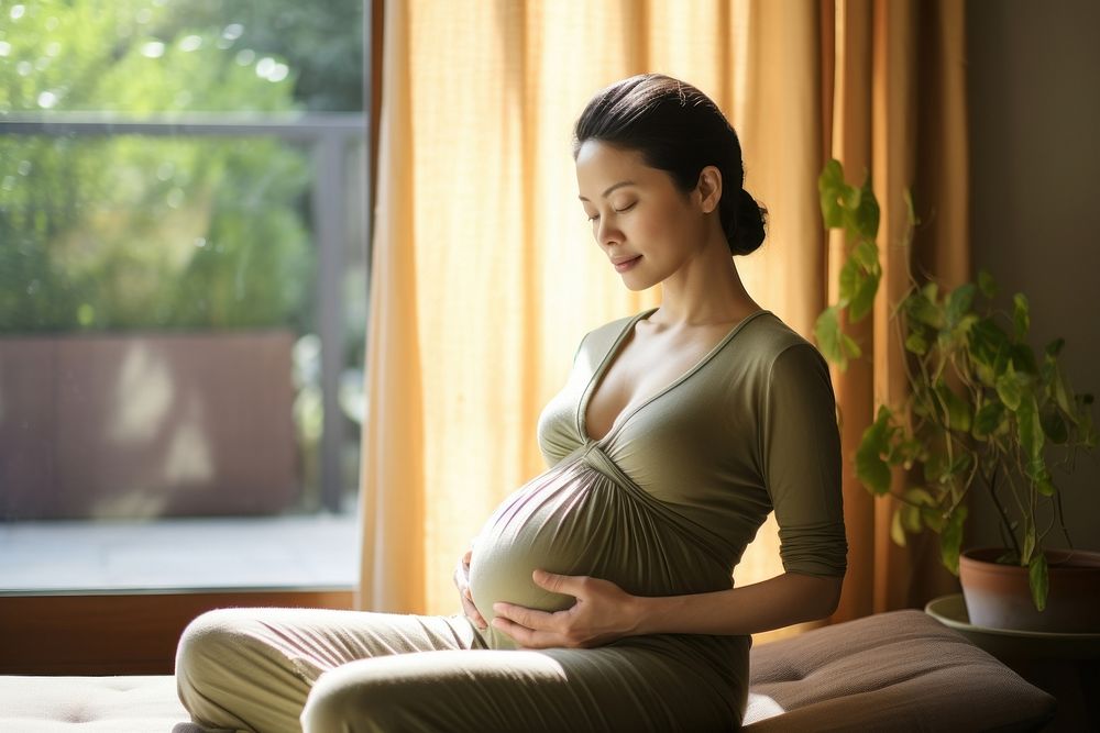 Asian woman meditating pregnant sitting. AI generated Image by rawpixel.