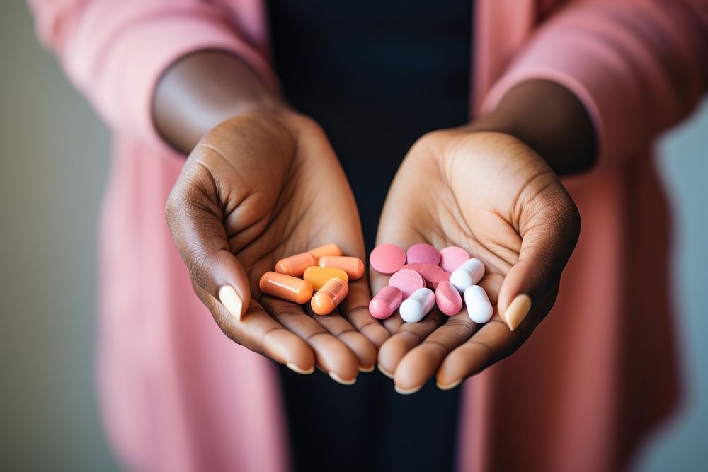 Black woman pill holding hand. AI generated Image by rawpixel.