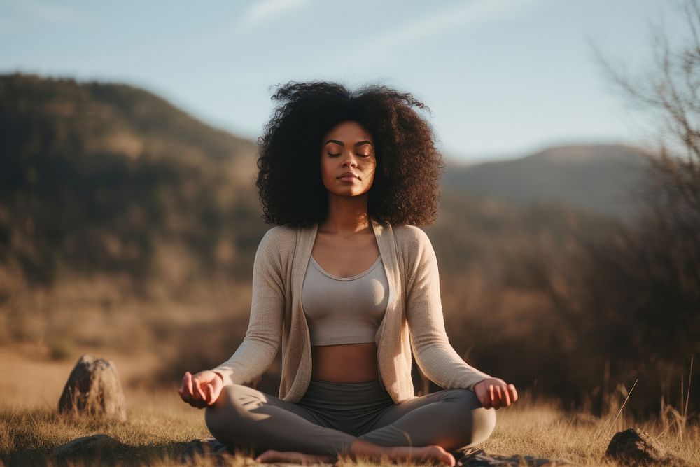 Black woman sports adult yoga. 