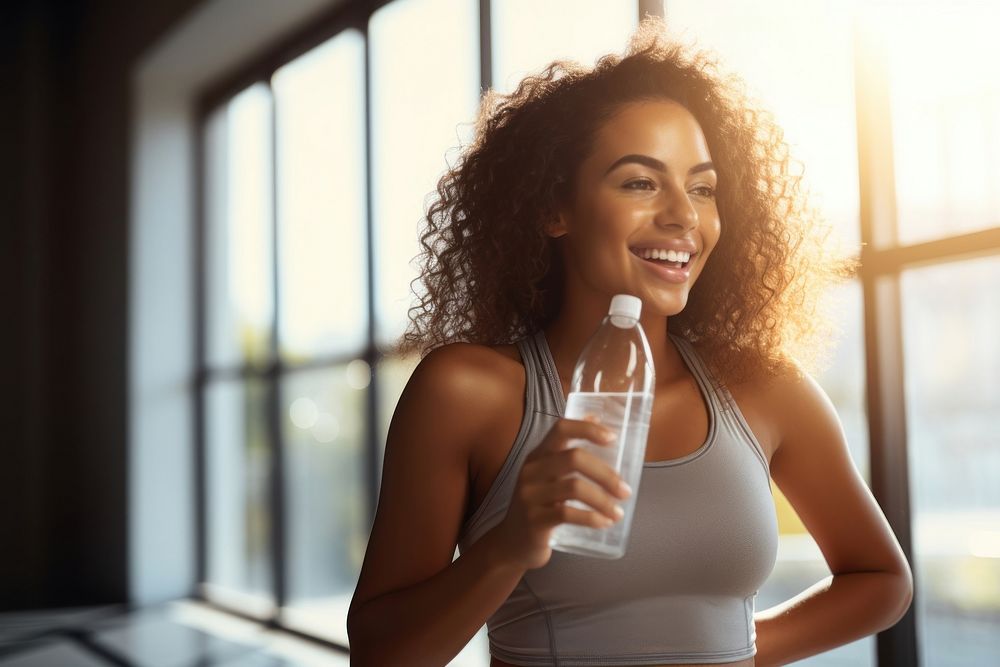 Black woman drinking smile drinking water. 
