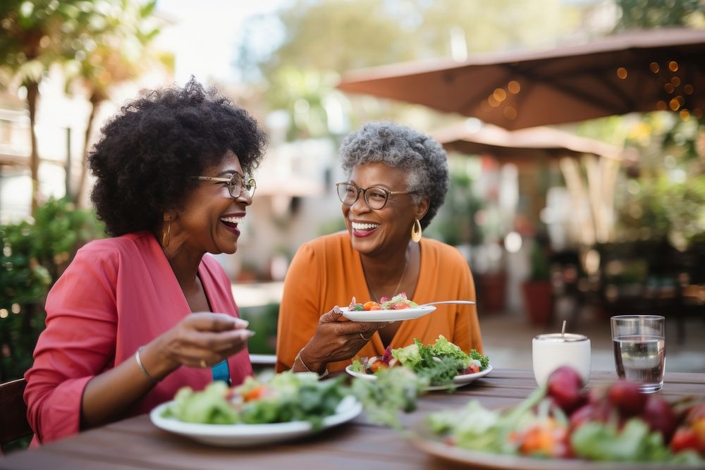 Black women laughing smiling eating. AI generated Image by rawpixel.