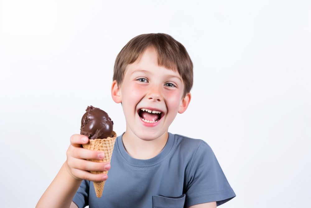 Kid holding chocolate ice cream dessert smiling eating. 